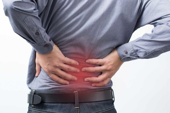 Backache Concept Bending Over In Pain - Prescott, AZ - Natural Back Pain Relief LLC