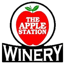 A logo for the apple station winery with an apple in the center