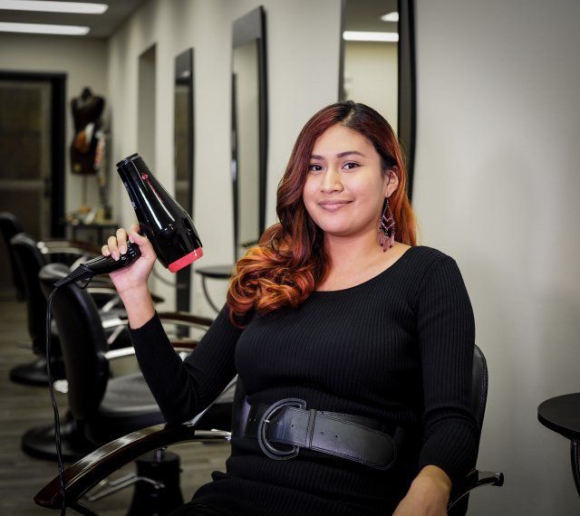 Facials — Beautiful Stylist Holding Hair Blower in Baton Rouge, LA
