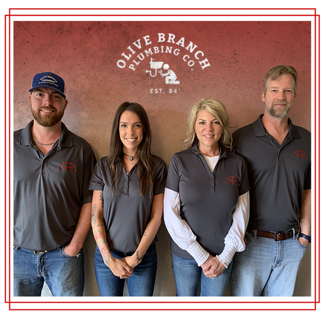 Four people in grey shirts, Olive Branch Plumbing Co. logo behind them.