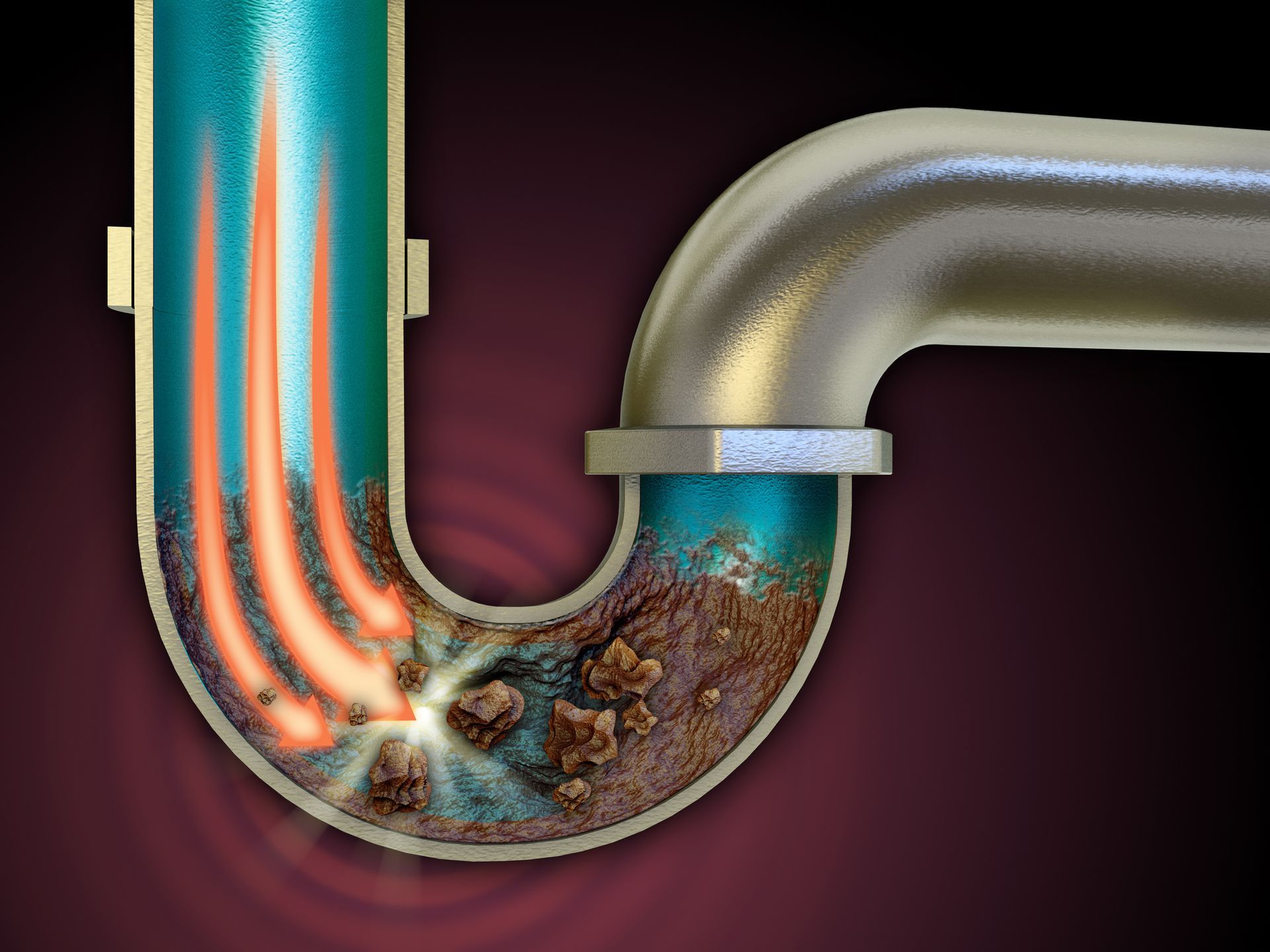 Water flowing down a stainless steel kitchen sink drain with a garbage disposal.