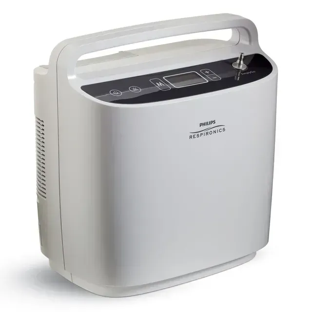 A white portable oxygen concentrator with a handle on a white background.