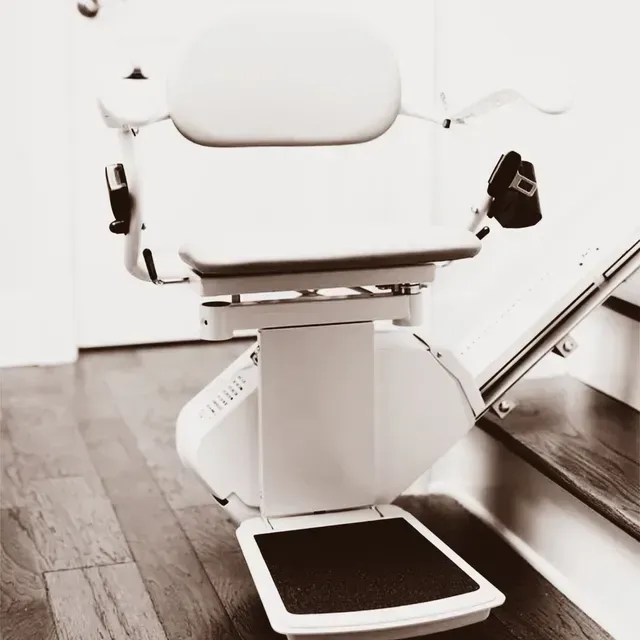 A black and white photo of a stair lift