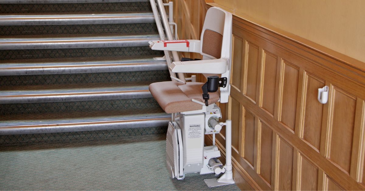 Indoor stairlift installed on a carpeted staircase for safe home access.