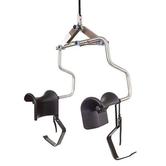 A pair of black chairs hanging from a rope on a white background.