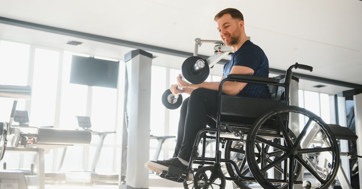 Patient in a wheelchair performing upper-body rehabilitation exercises.