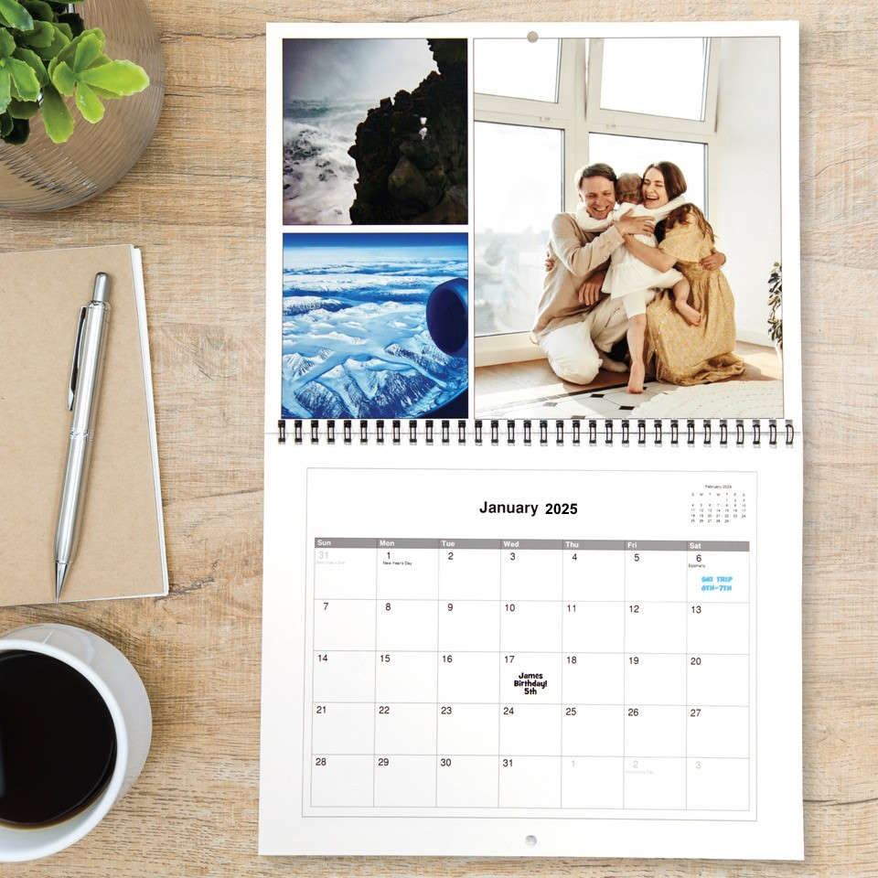 A calendar with flowers on a wooden table