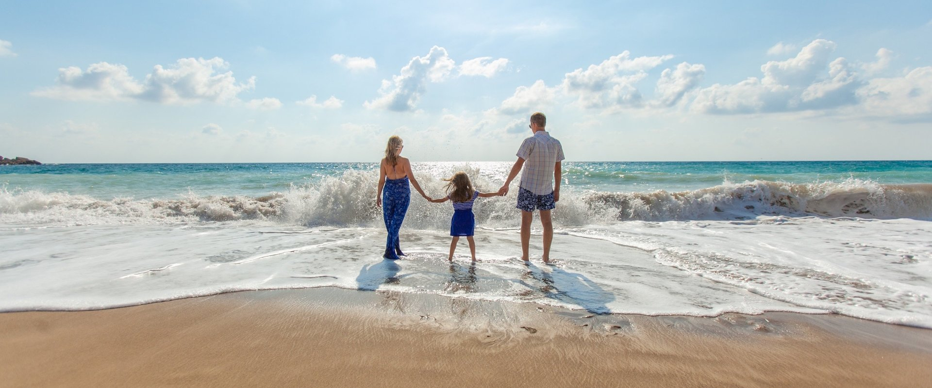 Parents and child at the beach