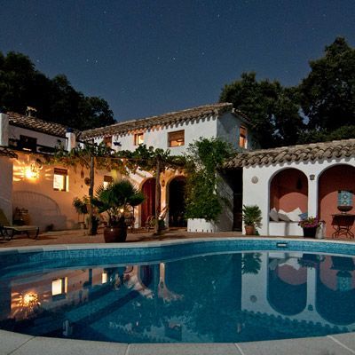 Estate with a pool at night