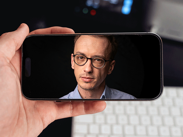 Video of a man on a phone.