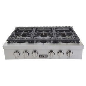 A stainless steel stove top oven with four burners and four knobs.