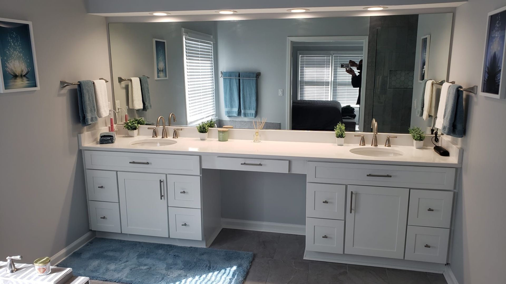 a bathroom with two sinks and a large mirror .