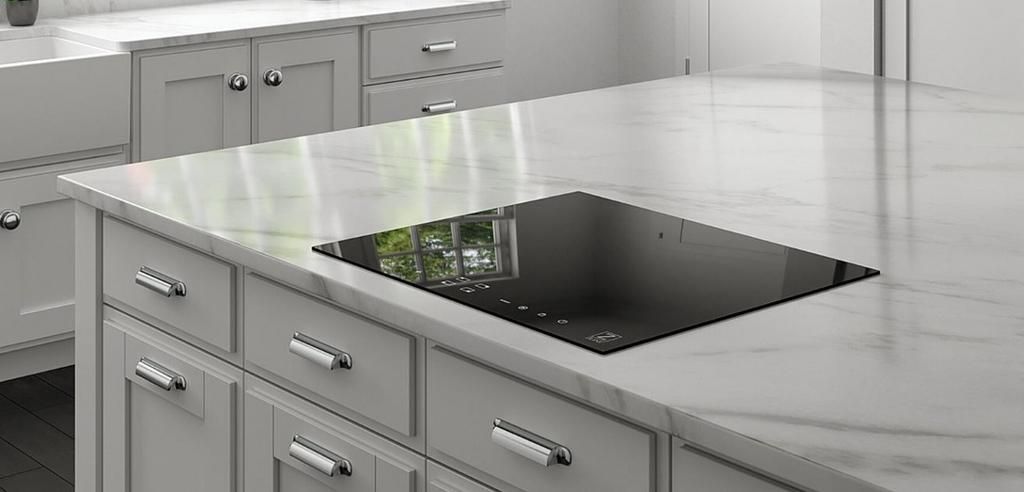 A kitchen with white cabinets and a black stove top oven.