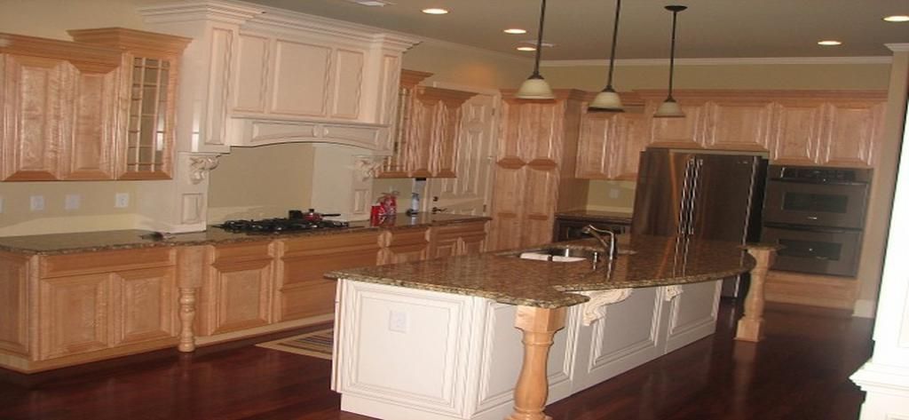 A kitchen with a large island in the middle