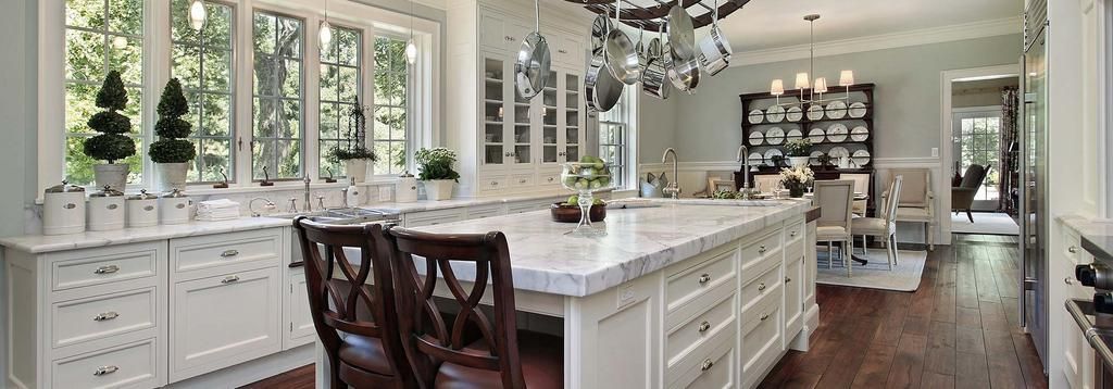 There is a large island in the middle of the kitchen.