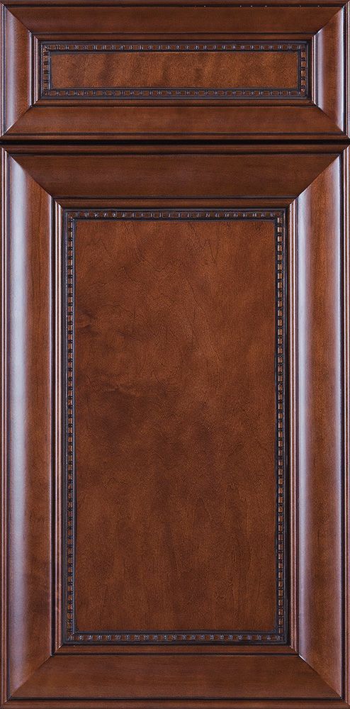 Dark brown wooden cabinet door with beveled trim and decorative beading.