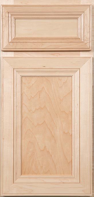 A close up of a wooden cabinet door on a wall.