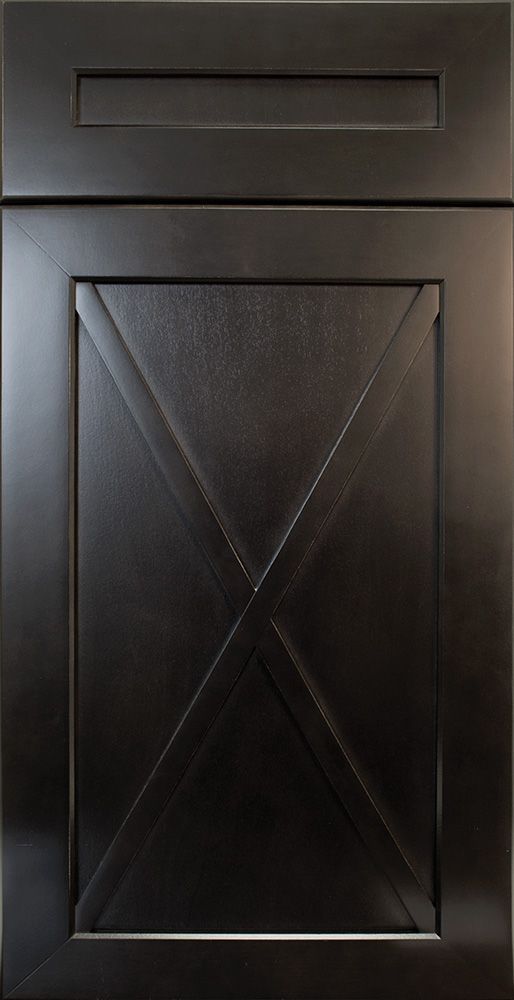 Dark gray cabinet door with an X-shaped design across a recessed panel, small upper rectangle.