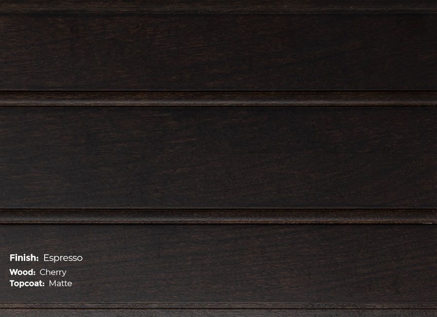 A close up of a piece of wood with a stained finish.