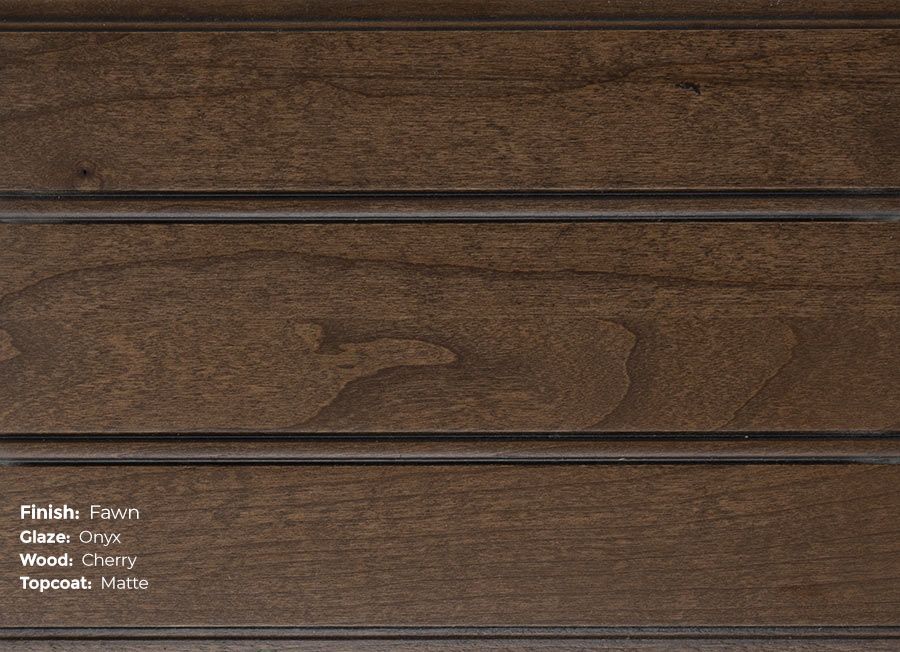 A close up of a piece of wood with a stained finish