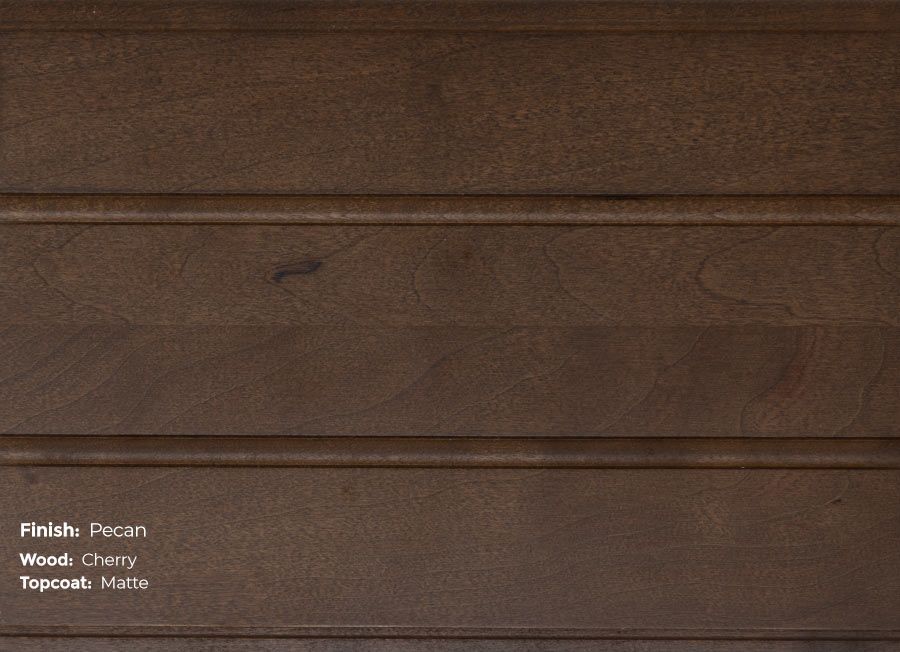 A close up of a piece of wood with a stained finish.