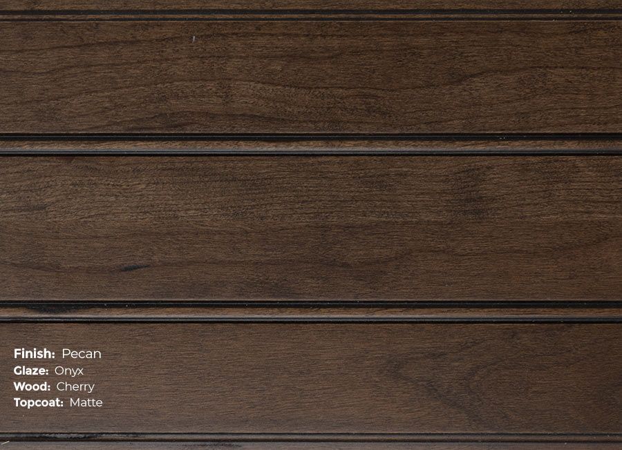 A close up of a piece of wood that says pecan on it