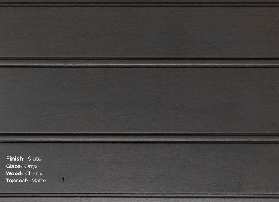 A close up of a black wall with a few lines on it.