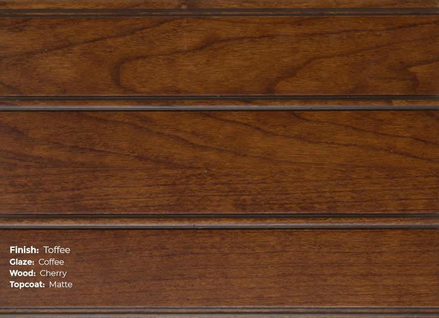 A close up of a piece of wood with a stained finish