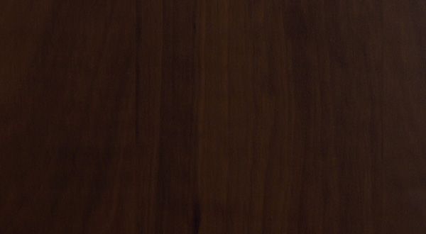 Dark brown wooden surface with vertical grain.