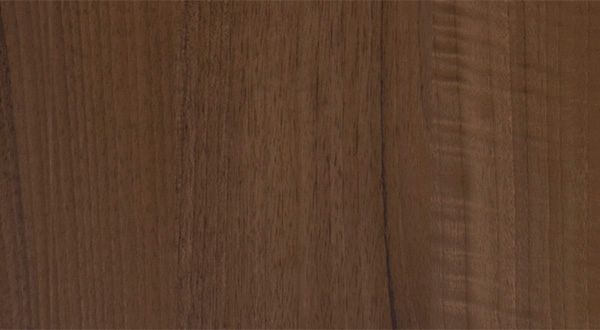 Close-up of brown wood grain with vertical lines, showcasing texture and natural color variation.