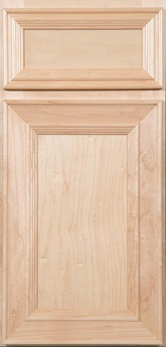 A close up of a wooden cabinet door on a table.