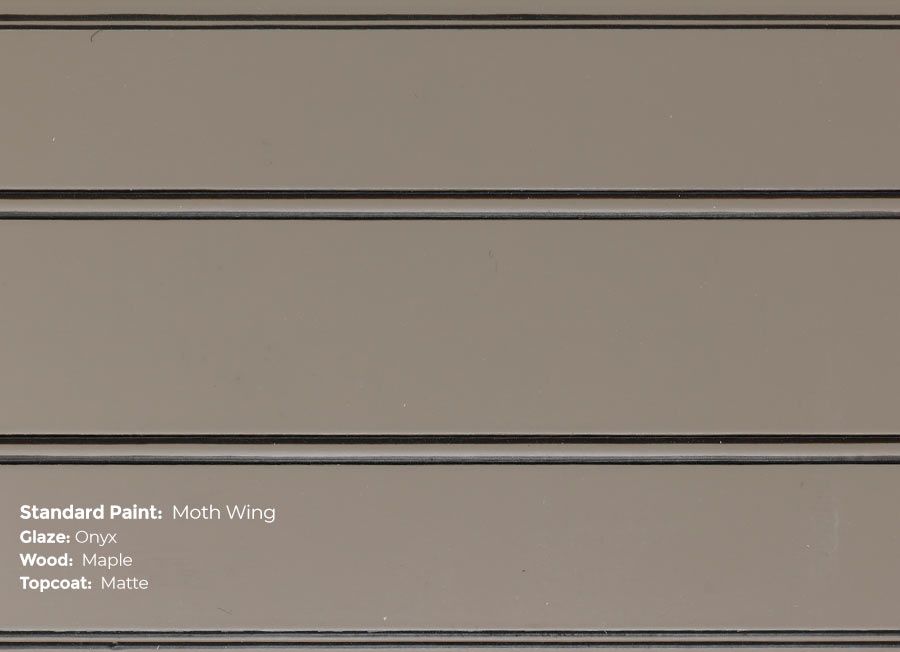 A close up of a piece of wood with a paint swatch on it.