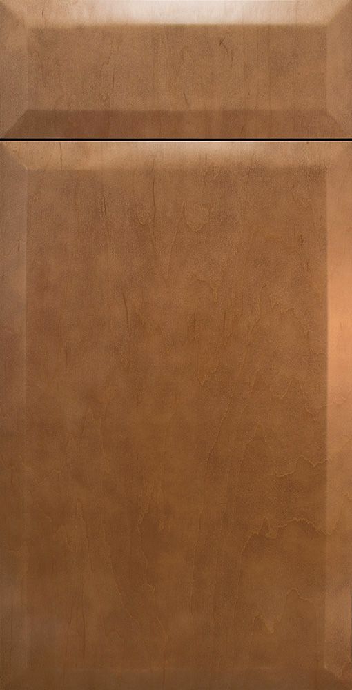 Close-up of a brown cabinet door with a framed design.