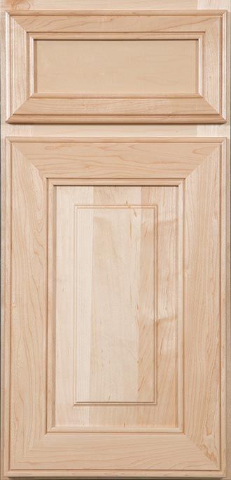 A close up of a wooden cabinet door on a wall.