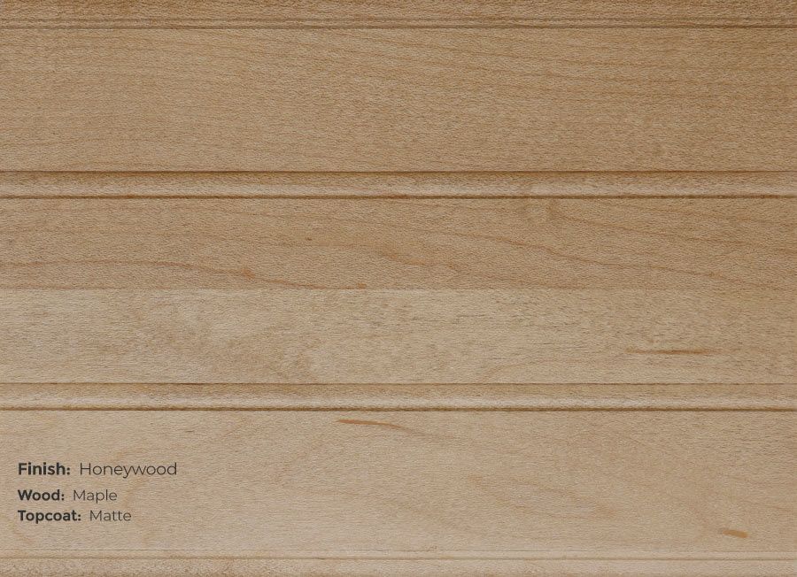 A close up of a piece of wood that says finish honeywood