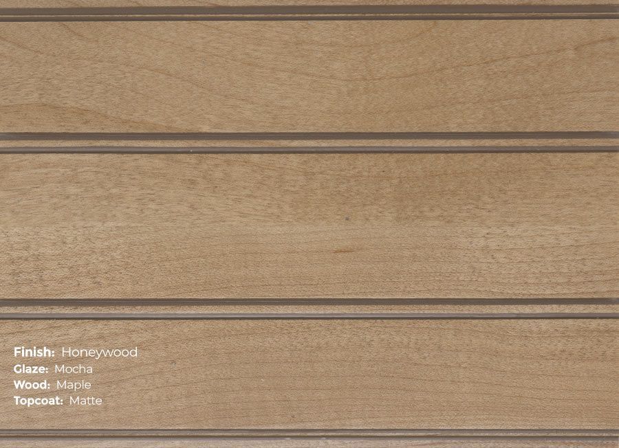 A close up of a piece of wood with the words honey wood written on it.