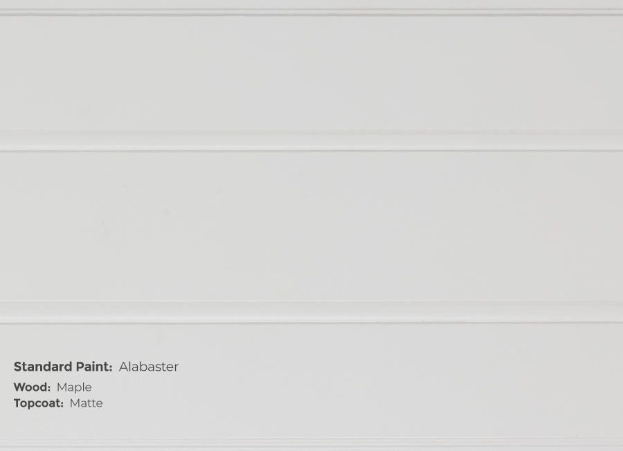 A close up of a white wall with the words standard paint on it.