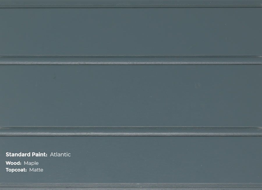 A close up of a gray wall with the words standard paint written on it