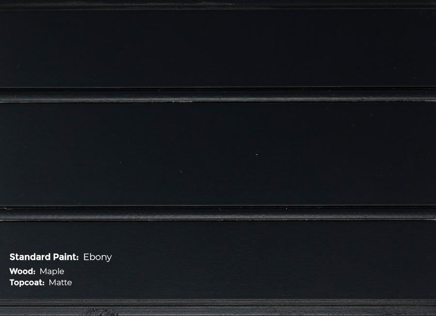 A close up of a black wall with the words standard paint on it