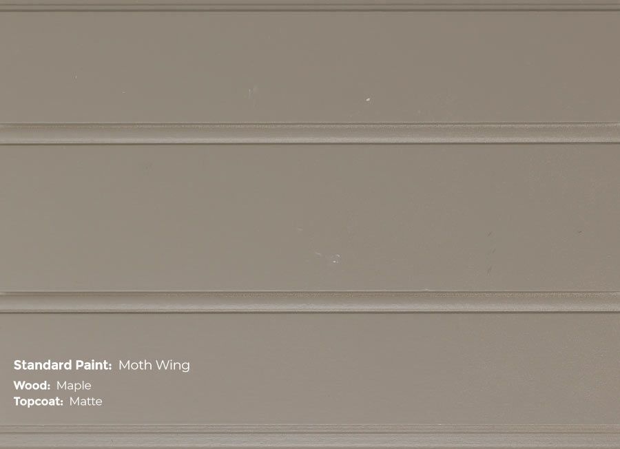 A close up of a wall with a gray paint.