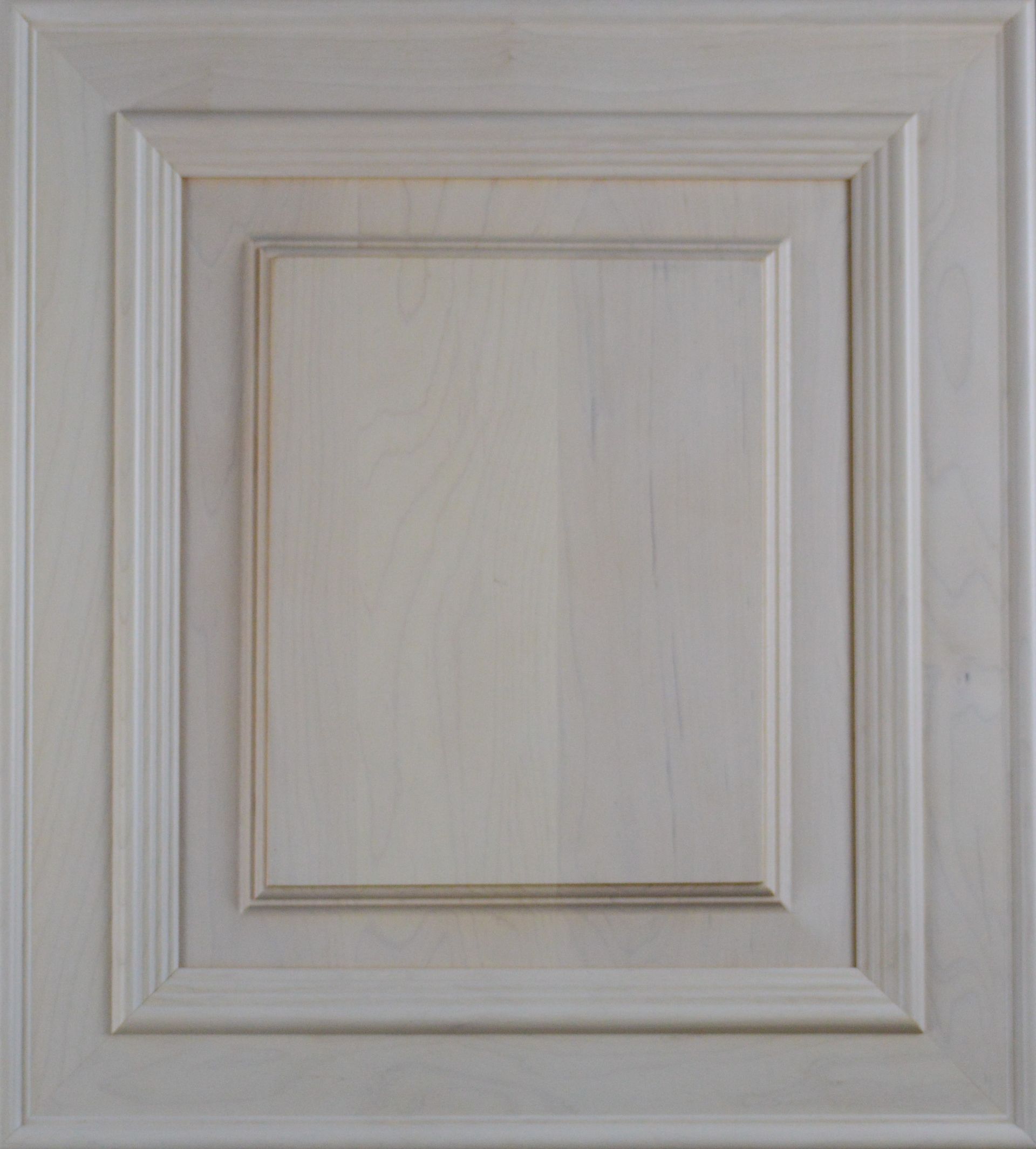 A close up of a white wooden cabinet door