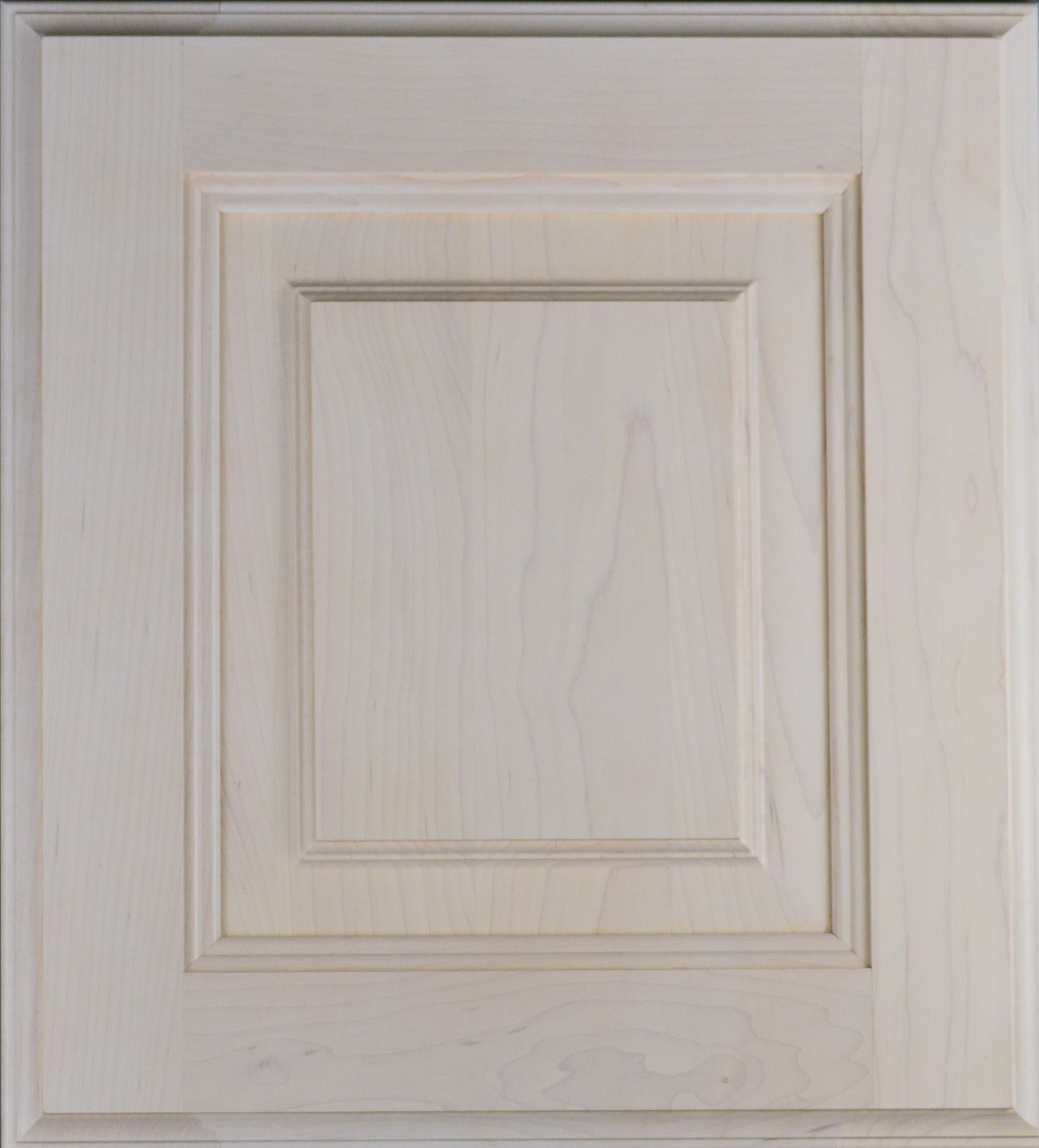 A white wooden cabinet door with a square frame