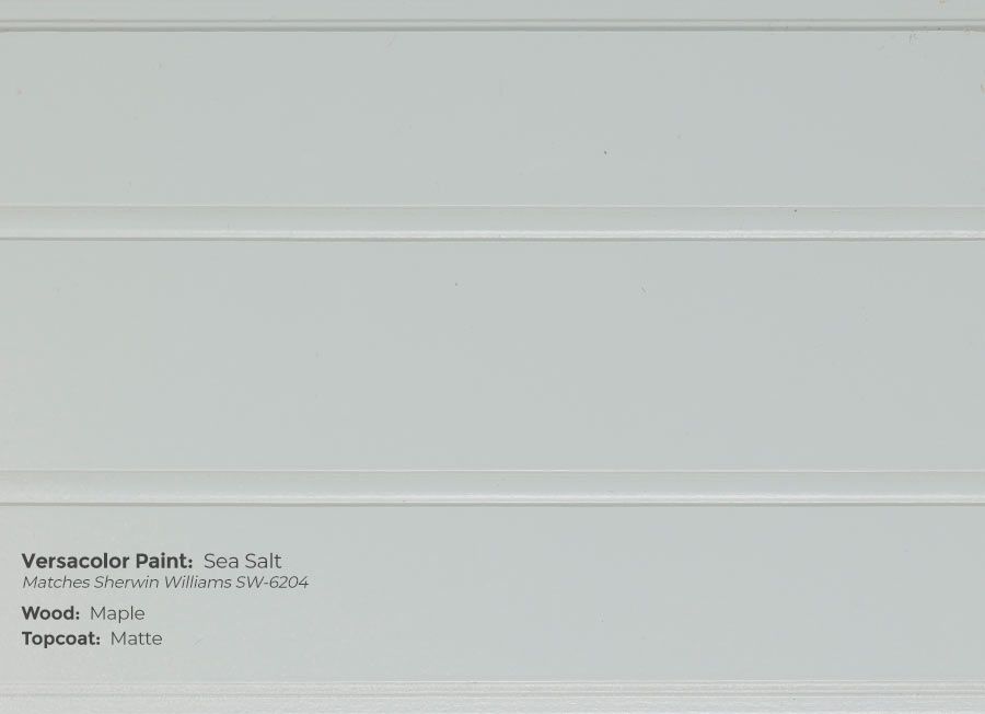 A close up of a piece of white paint on a wall.