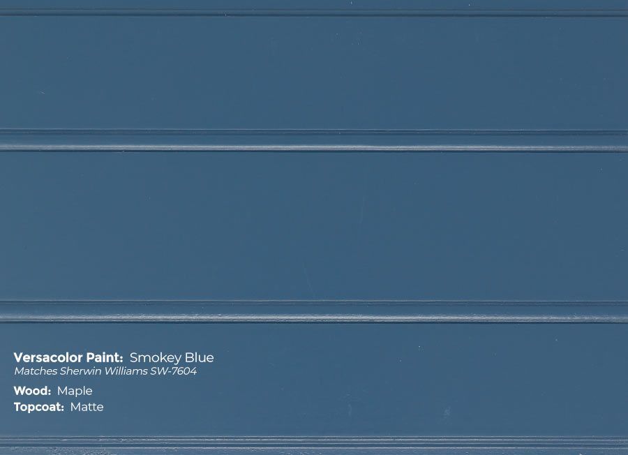 A close up of a blue paint swatch on a wall.