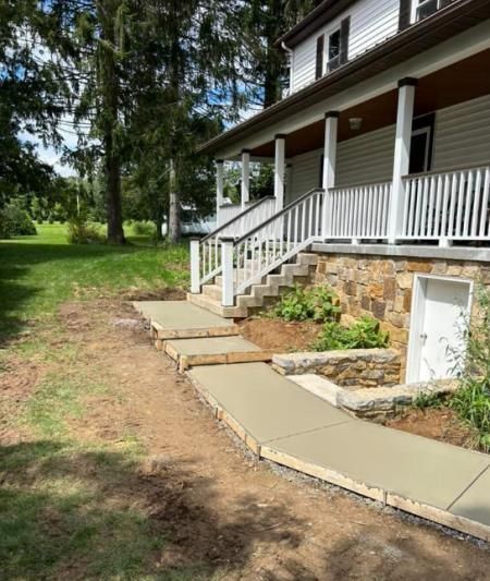 A house with a porch and stairs leading up to it