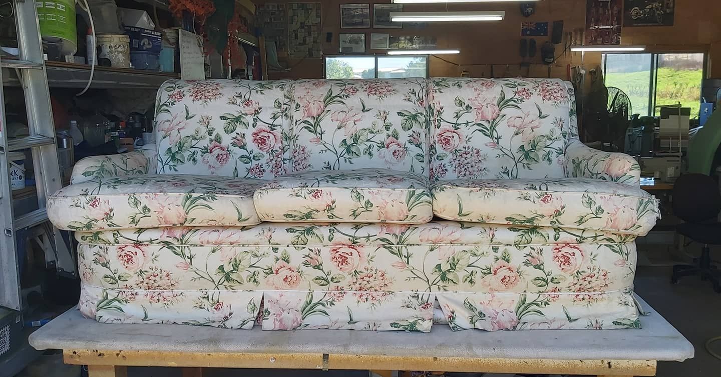 A Floral-patterned Sofa on a Wooden Table — Cupitt's Quality Upholstery in Rous, NSW