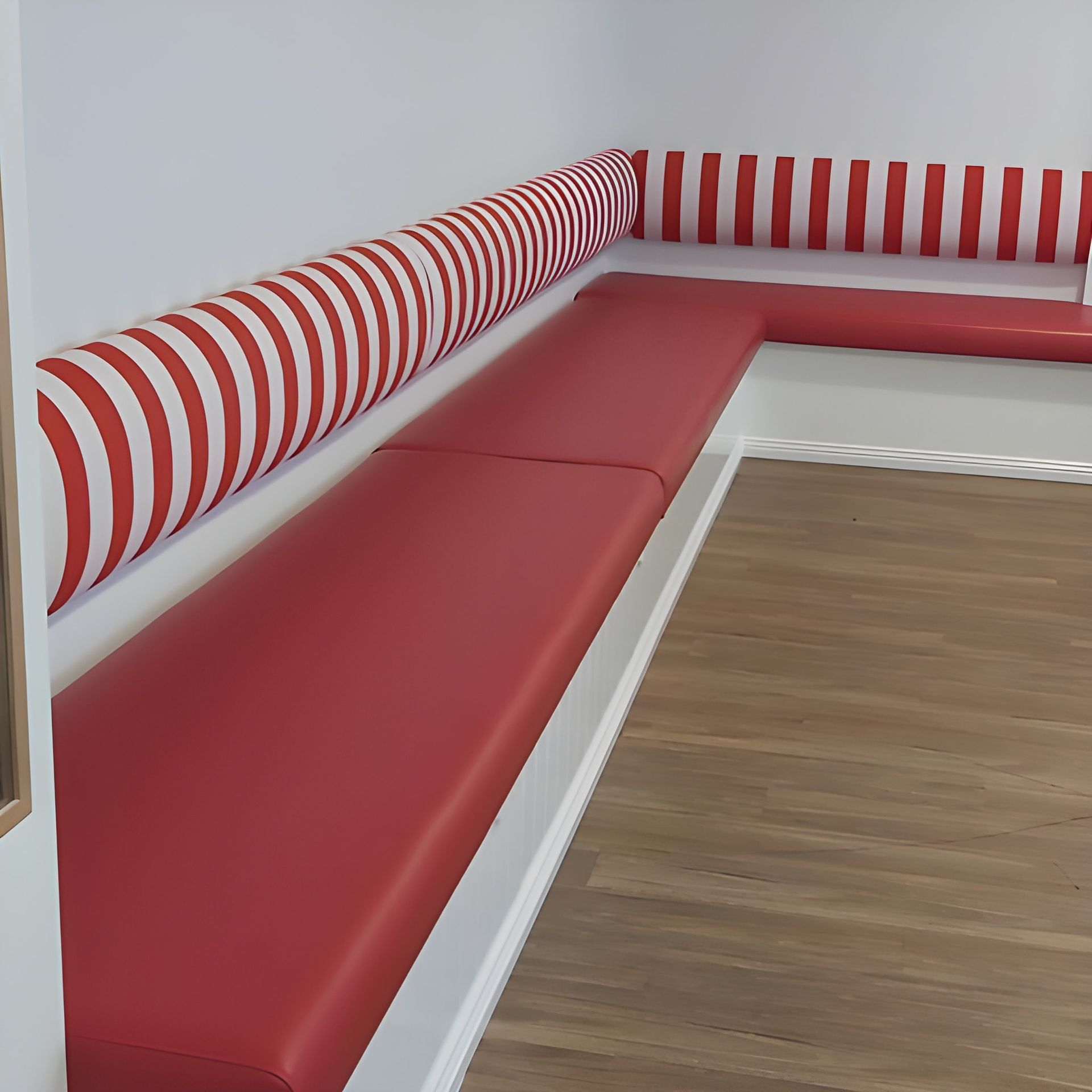 A Red and Grey Patterned Armchair on a Workbench — Cupitt's Quality Upholstery in Rous, NSW