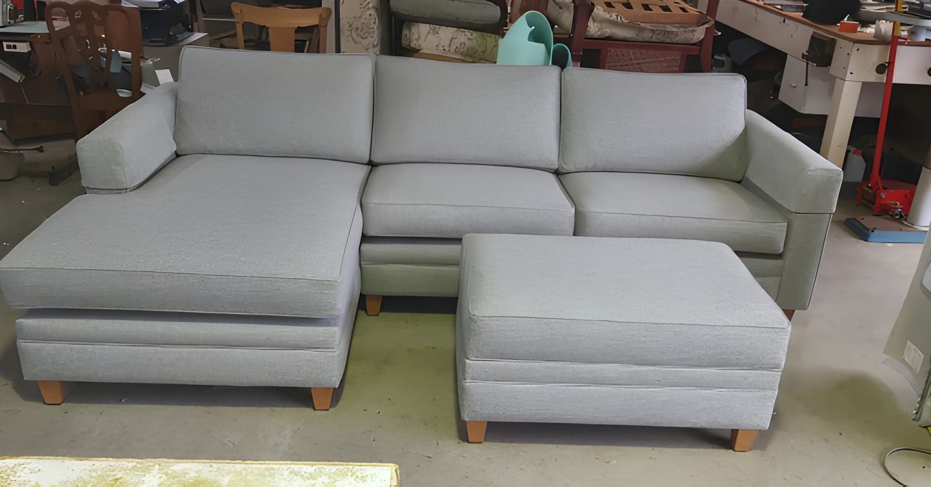 A Light Gray Sectional Sofa With a Matching Ottoman — Cupitt's Quality Upholstery in Lismore, NSW
