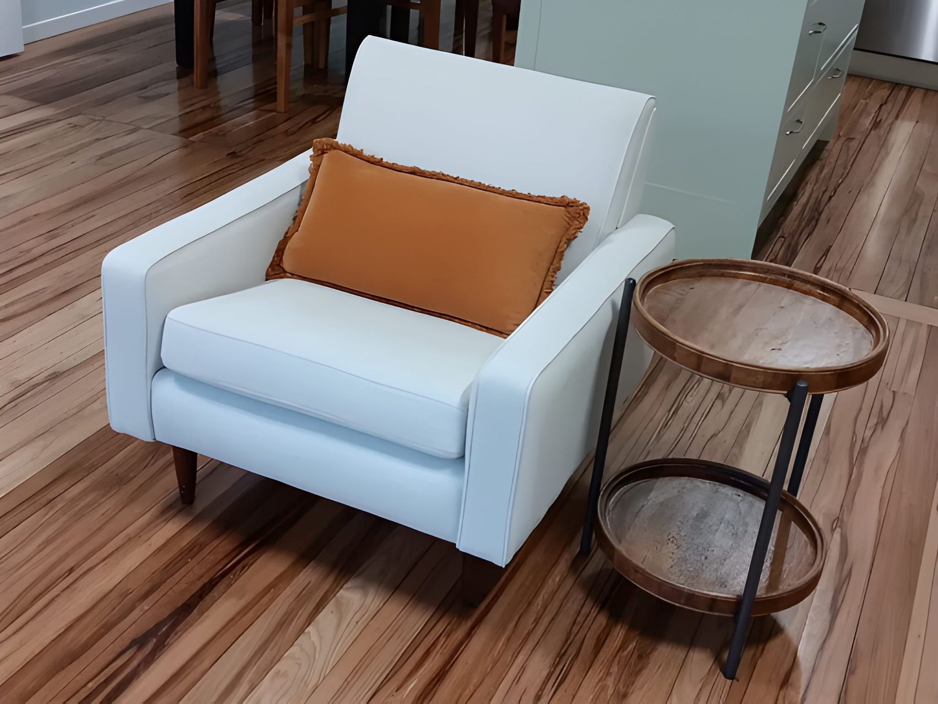 A White Armchair With Orange Pillow — Cupitt's Quality Upholstery in Byron Bay, NSW