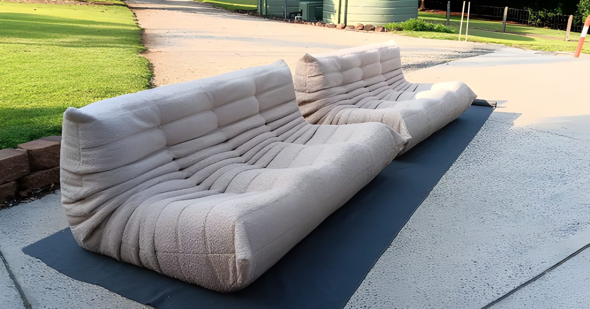 A Beige Modular Sofa on a Dark Mat — Cupitt's Quality Upholstery in Yamba, NSW